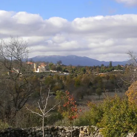 Amygdalia, A Stone House In A Quiet Landscape