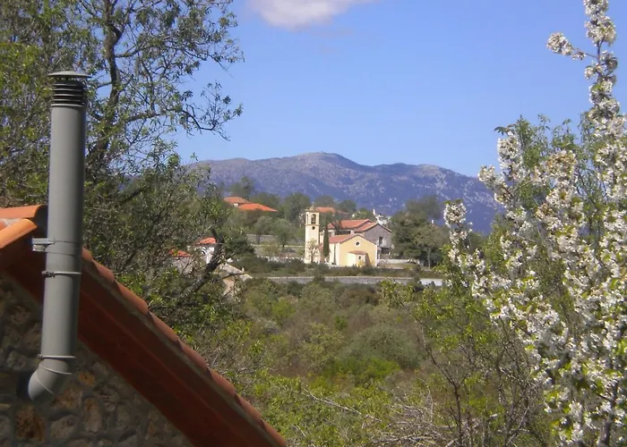 Amygdalia, A Stone House In A Quiet Landscape